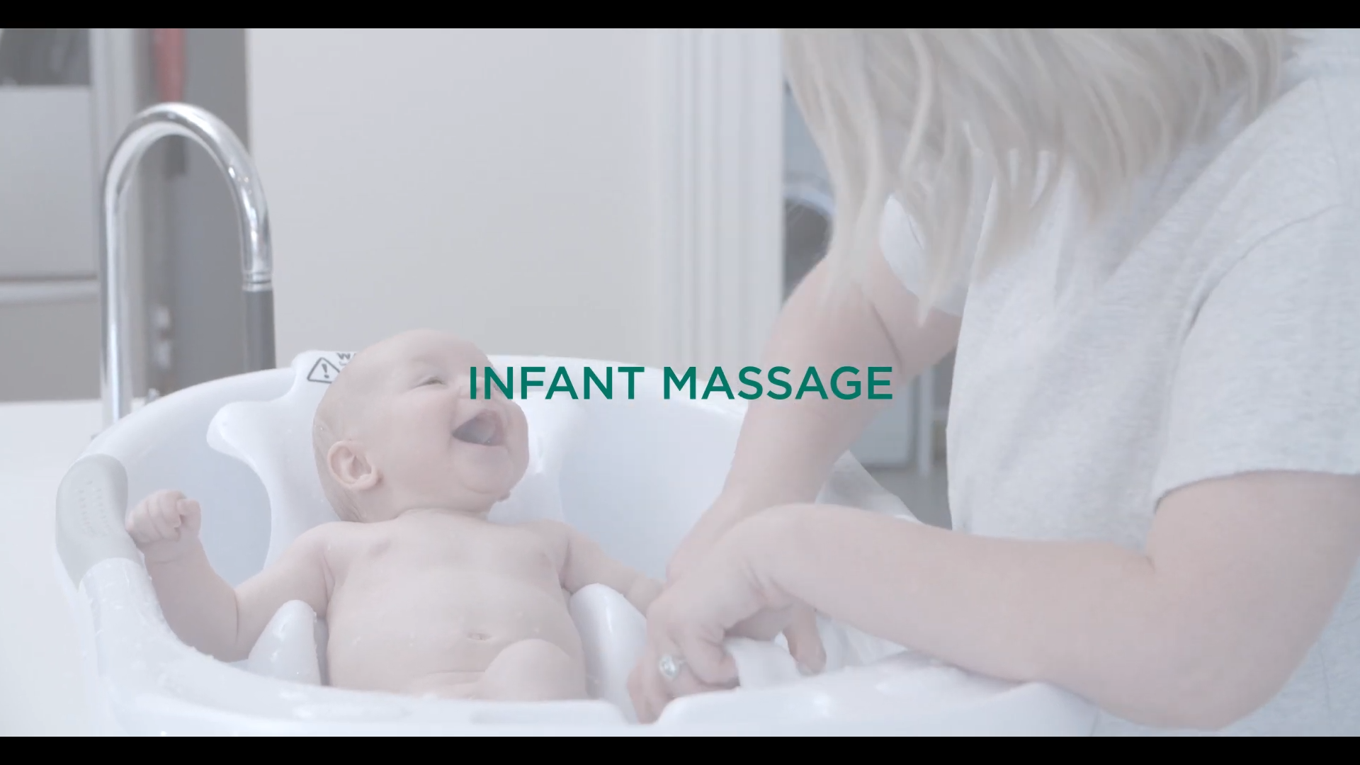 Gentle bonding moment with mother and baby using Newborn Massage Oil from GAIA Skin Naturals for infant skin nourishment